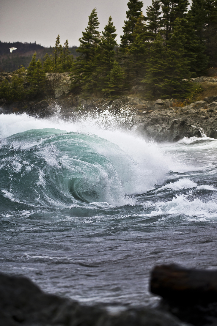 Powerful Lake Superior waves crash at the mouth of the Michipicoten River in Ontario Canada during a fall storm.