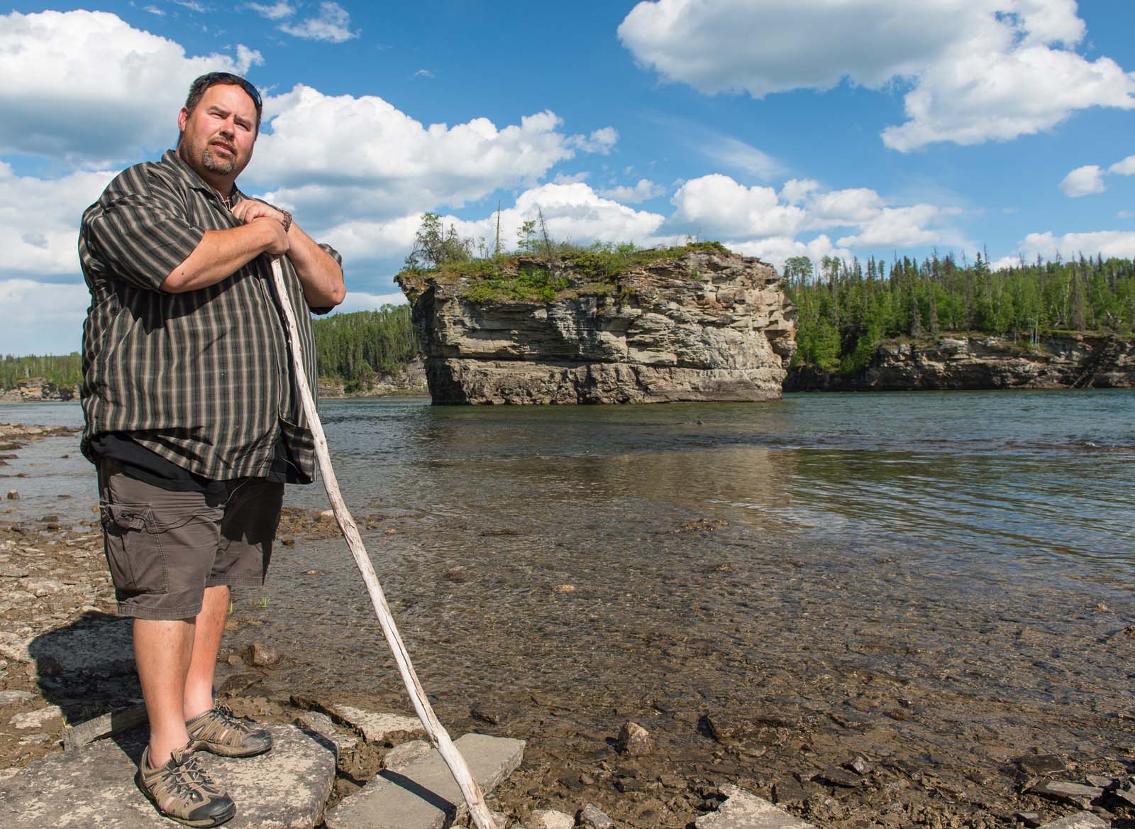 Chief Roland Wilson stands beside the Peace River near Hudson’s Hope.
