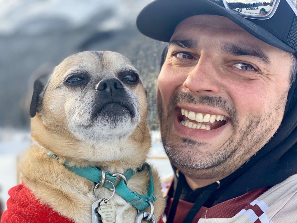 Shot on iPhone The 11th Annual Lake Louise Pond Hockey Classic Man Dog