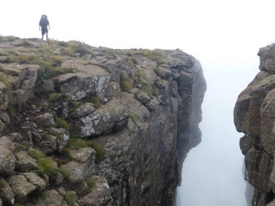 Trekking the Worlds Edge Lesothos Drakensberg Traverse mountain gorge Michael Henry hiker