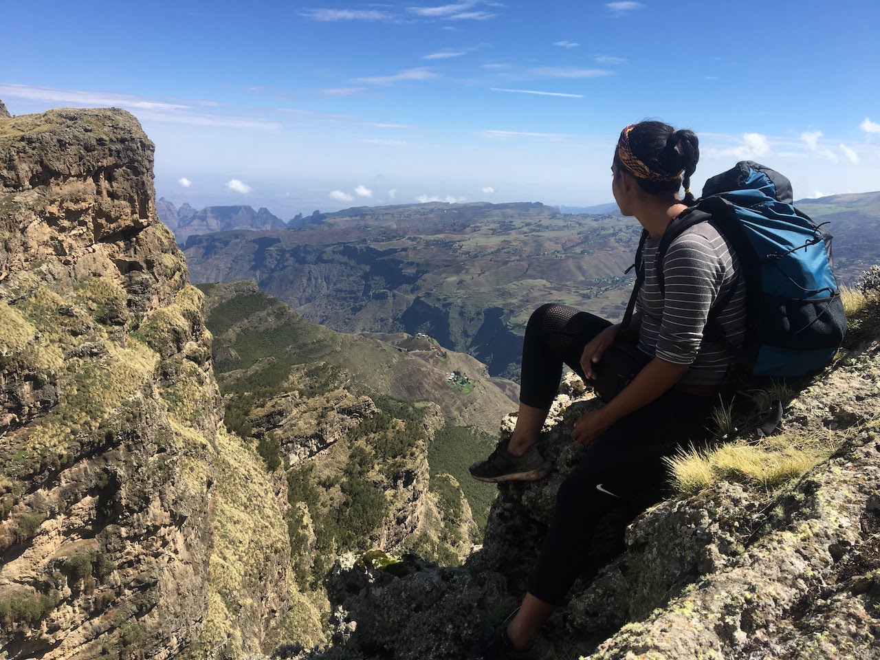 Trekking-Ethiopias-Simien-Mountains-Mafia-AK-47s-and-a-Park-at-Risk-backpacker-sitting-canyon