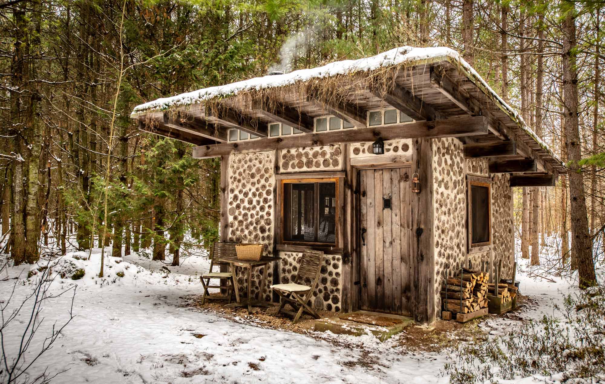 The-Cordwood-Cabin-An-Accessible-Retreat-from-the-21st-Century-cabin-exterior-photo-by-Kristin-Schnelten