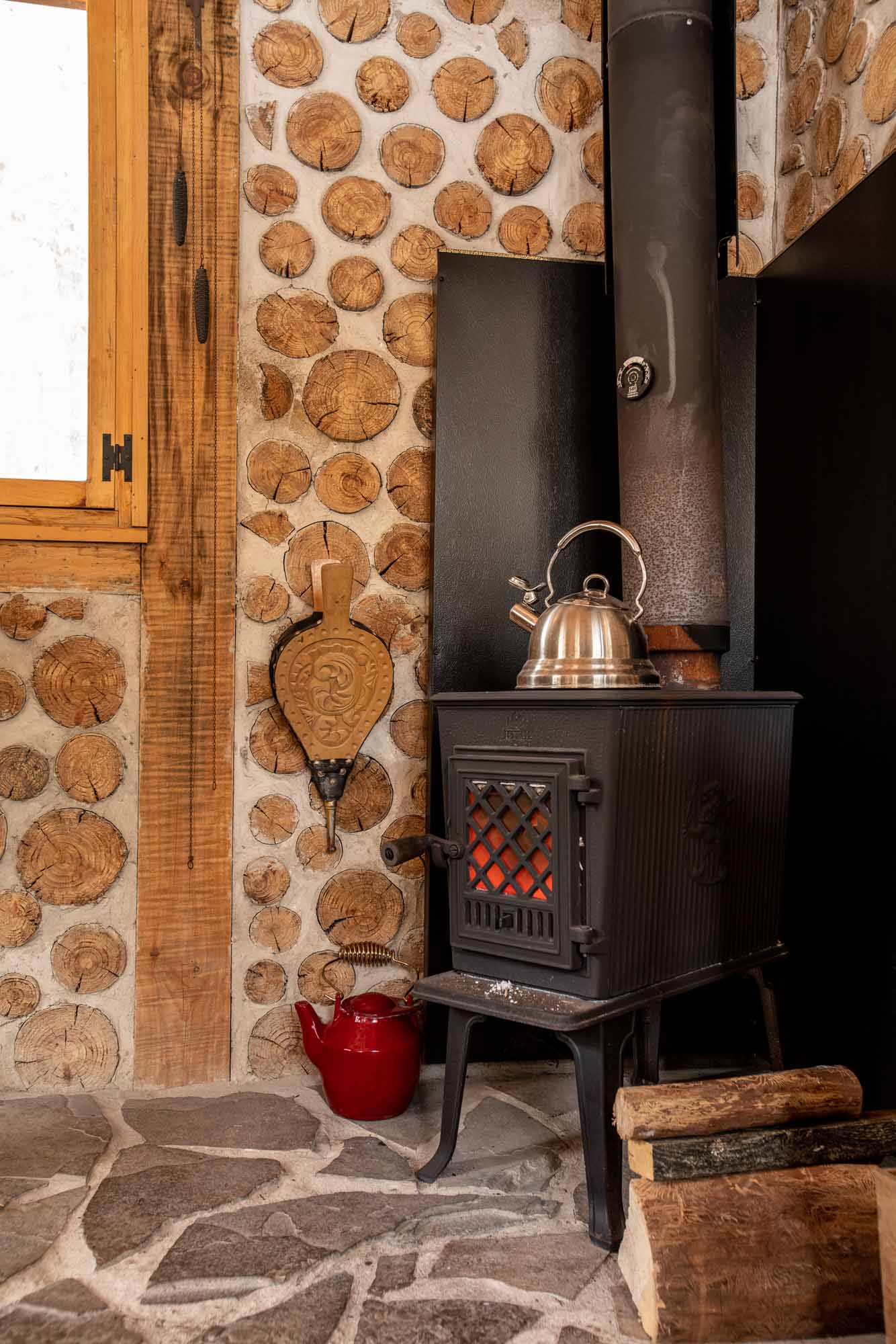 The-Cordwood-Cabin-An-Accessible-Retreat-from-the-21st-Century-woodstove-photo-by-Kristin-Schnelten