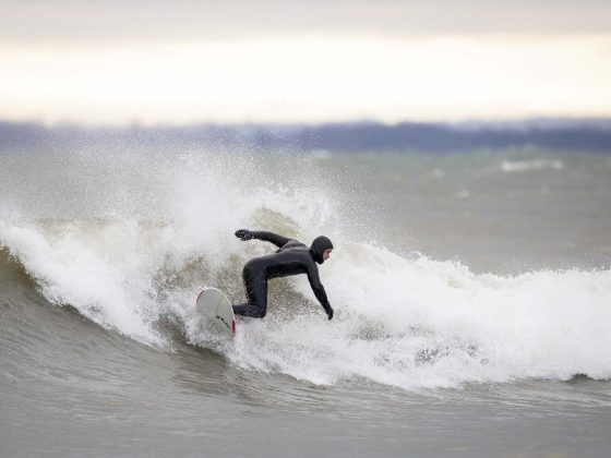 A surfer on a wave in Georgian Bay, Ontario.