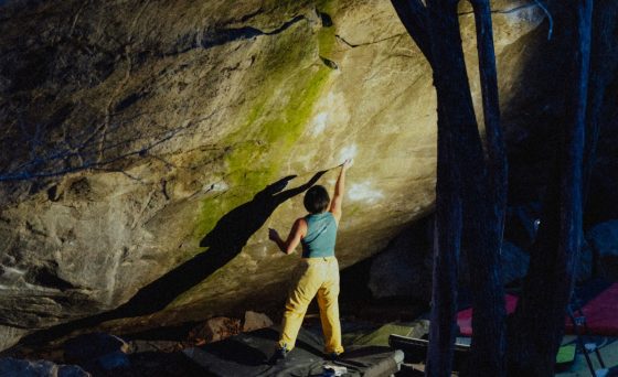 Ashima Shiraishi rock-climbing at night.