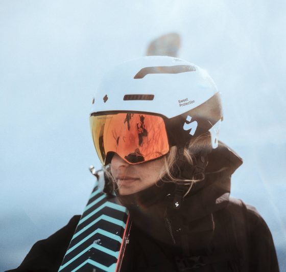a woman wearing snow googles and helmet