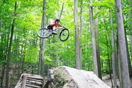 Mountain bike getting air in Ontario forest