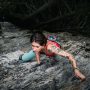 Paraclimbing woman rock climbing in BC