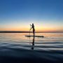 woman paddle boarding on Georgian Bay at sunset